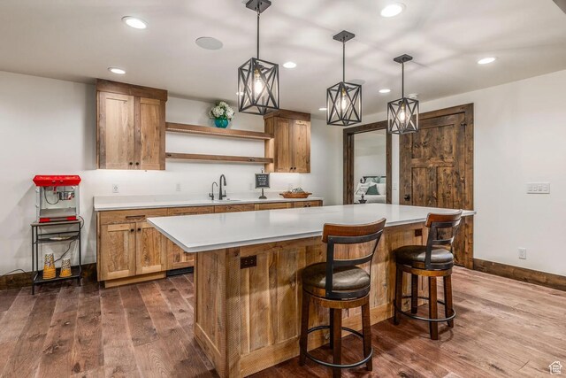 900 W Weber Canyon Rd, Oakley, UT 84055 - kitchen featuring open shelves, dark wood finished floors, a kitchen island, light countertops, and recessed lighting