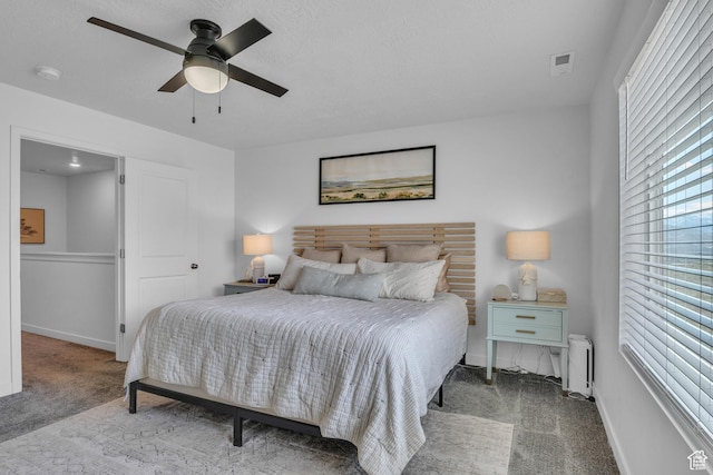 3791 W Soft Whisper Way, Herriman, UT 84096 - bedroom with carpet floors, radiator heating unit, baseboards, and ceiling fan