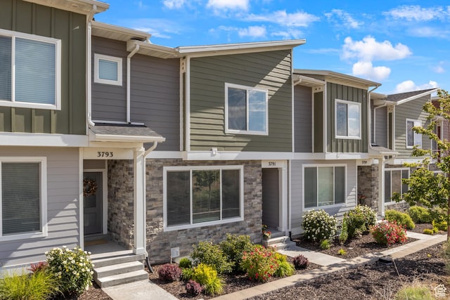 3791 W Soft Whisper Way, Herriman, UT 84096 - view of property with board and batten siding and stone siding