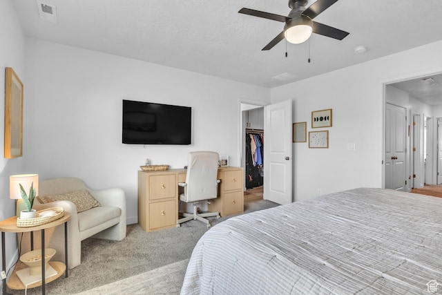 3791 W Soft Whisper Way, Herriman, UT 84096 - carpeted bedroom featuring a spacious closet, a ceiling fan, and a closet