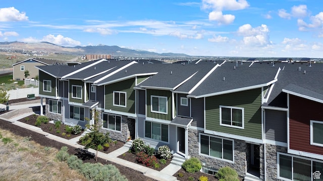 3791 W Soft Whisper Way, Herriman, UT 84096 - view of front of property with stone siding, a mountain view, board and batten siding, and entry steps