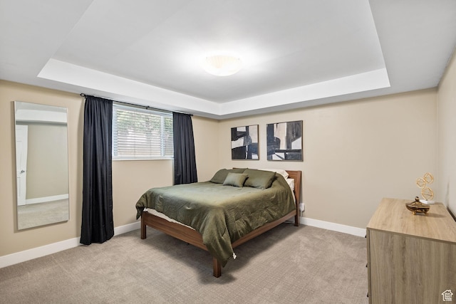 2220 E Murray Holladay Rd Unit 156, Holladay, UT 84117 - bedroom featuring a tray ceiling, light carpet, and baseboards