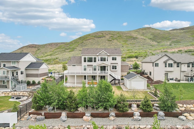 15056 S Sage Terrace Ln Unit 1014, Herriman, UT 84096 - rear view of house with stairway, a residential view, an outbuilding, a garage, and central AC