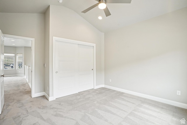 15056 S Sage Terrace Ln Unit 1014, Herriman, UT 84096 - unfurnished bedroom featuring light carpet, lofted ceiling, baseboards, a closet, and a ceiling fan