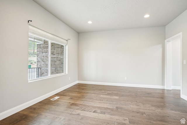 15056 S Sage Terrace Ln Unit 1014, Herriman, UT 84096 - unfurnished room with wood finished floors, recessed lighting, and baseboards
