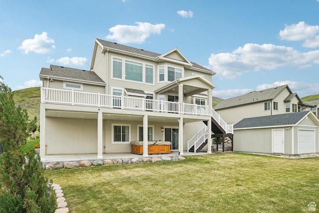 15056 S Sage Terrace Ln Unit 1014, Herriman, UT 84096 - back of property with a hot tub, stucco siding, an outdoor structure, and a yard