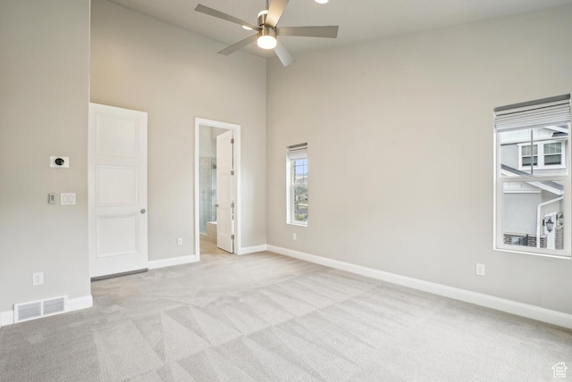 15056 S Sage Terrace Ln Unit 1014, Herriman, UT 84096 - unfurnished room with high vaulted ceiling, light colored carpet, a ceiling fan, and baseboards