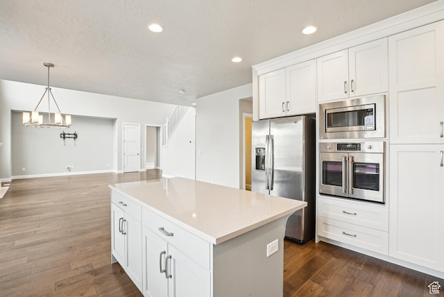 15056 S Sage Terrace Ln Unit 1014, Herriman, UT 84096 - kitchen featuring stainless steel appliances, a chandelier, dark wood-style flooring, white cabinets, and recessed lighting