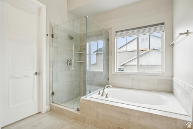 15056 S Sage Terrace Ln Unit 1014, Herriman, UT 84096 - full bathroom featuring a shower stall, a garden tub, and tile patterned flooring