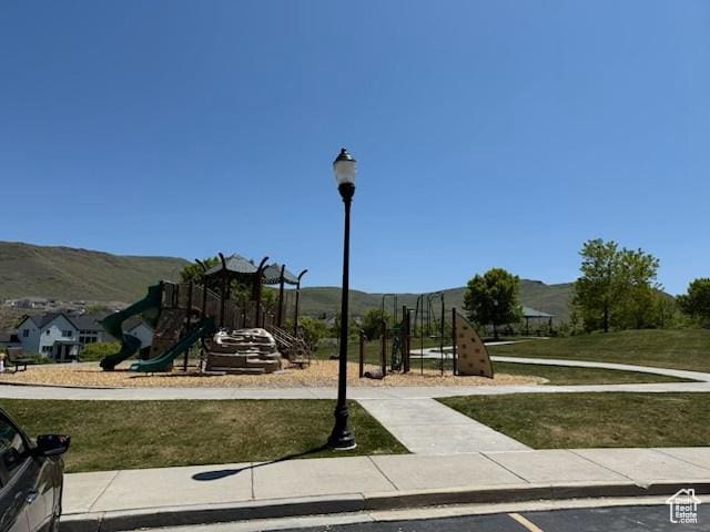 15056 S Sage Terrace Ln Unit 1014, Herriman, UT 84096 - community jungle gym with a mountain view and a lawn
