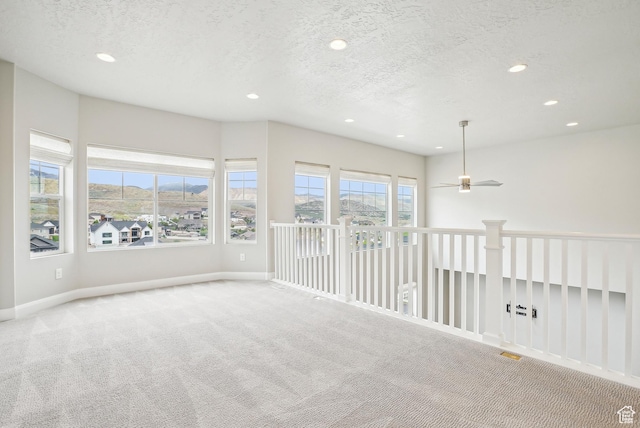 15056 S Sage Terrace Ln Unit 1014, Herriman, UT 84096 - empty room featuring carpet, recessed lighting, baseboards, a textured ceiling, and ceiling fan