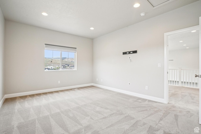 15056 S Sage Terrace Ln Unit 1014, Herriman, UT 84096 - spare room featuring light colored carpet, recessed lighting, and baseboards