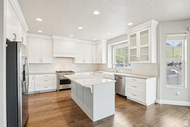 15056 S Sage Terrace Ln Unit 1014, Herriman, UT 84096 - kitchen featuring appliances with stainless steel finishes, white cabinetry, backsplash, recessed lighting, and a textured ceiling