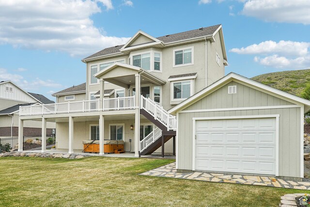15056 S Sage Terrace Ln Unit 1014, Herriman, UT 84096 - view of front facade featuring a hot tub, a front yard, stairway, and a deck