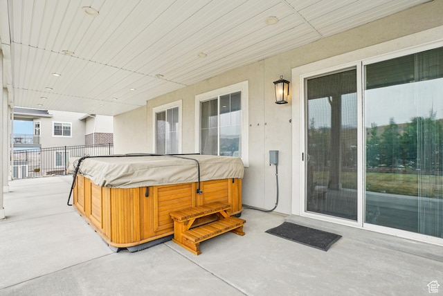 15056 S Sage Terrace Ln Unit 1014, Herriman, UT 84096 - view of patio featuring a hot tub