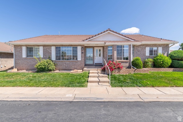1055 E 900 S Unit 61, St George, UT 84790 - ranch-style home featuring a tile roof, brick siding, and a front yard