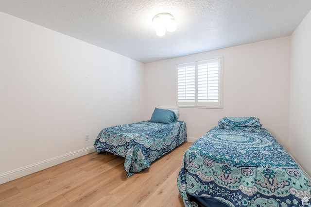 1055 E 900 S Unit 61, St George, UT 84790 - bedroom featuring wood finished floors, baseboards, and a textured ceiling