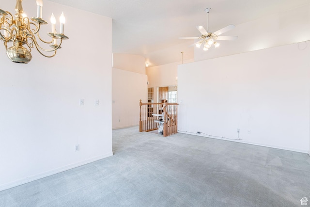 1055 E 900 S Unit 61, St George, UT 84790 - unfurnished living room featuring light colored carpet, ceiling fan, vaulted ceiling, a chandelier, and baseboards