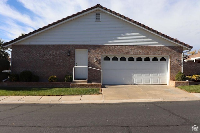 1055 E 900 S Unit 61, St George, UT 84790 - ranch-style home featuring driveway, a tile roof, and brick siding