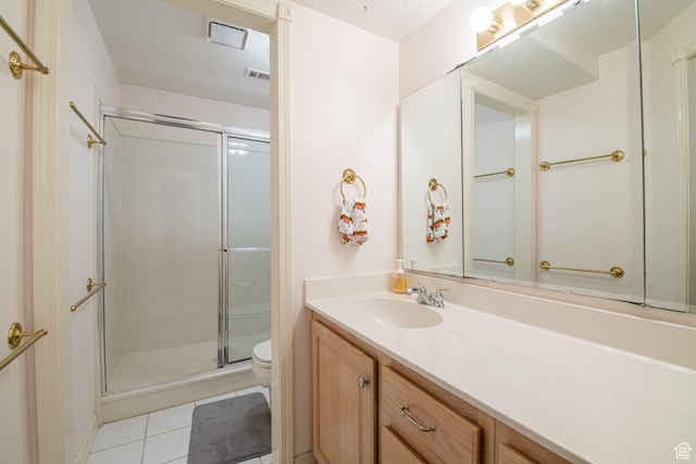 1055 E 900 S Unit 61, St George, UT 84790 - bathroom with toilet, a stall shower, vanity, and tile patterned floors