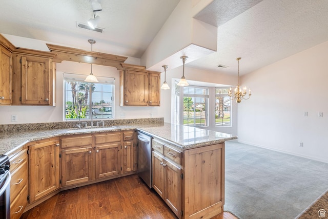 1055 E 900 S Unit 61, St George, UT 84790 - kitchen featuring a sink, stainless steel appliances, a peninsula, brown cabinets, and decorative light fixtures