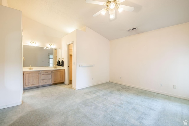 1055 E 900 S Unit 61, St George, UT 84790 - unfurnished bedroom with light carpet, a sink, lofted ceiling, baseboards, and ensuite bathroom