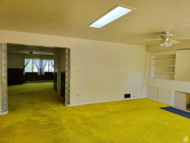 494 W 400 S, Cedar City, UT 84720 - carpeted empty room with a ceiling fan, baseboards, and a fireplace