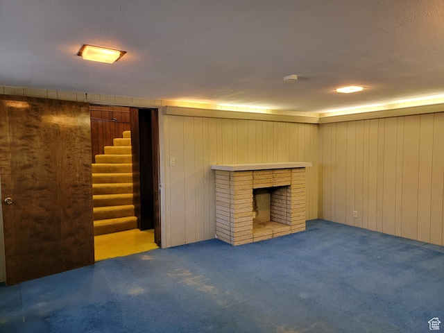 494 W 400 S, Cedar City, UT 84720 - finished basement with carpet, wooden walls, stairway, and a fireplace