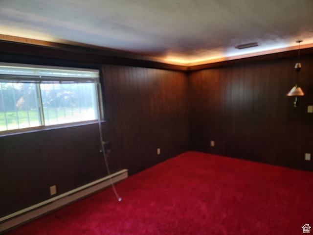494 W 400 S, Cedar City, UT 84720 - spare room featuring a baseboard radiator, carpet flooring, and wooden walls