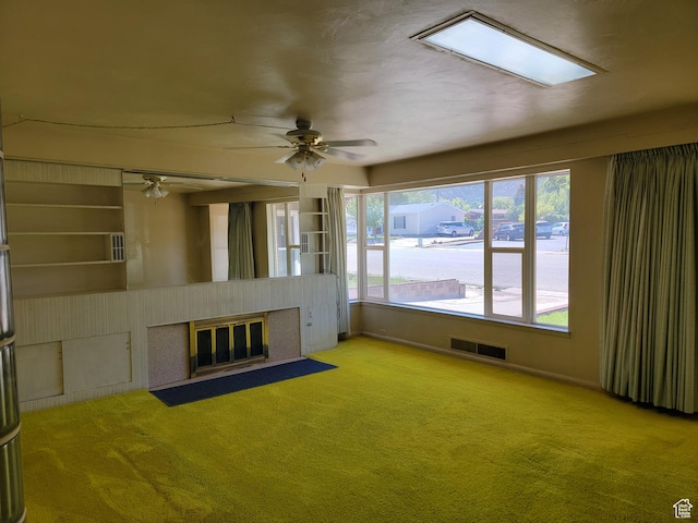 494 W 400 S, Cedar City, UT 84720 - unfurnished living room with a fireplace with flush hearth, carpet flooring, a ceiling fan, and baseboards