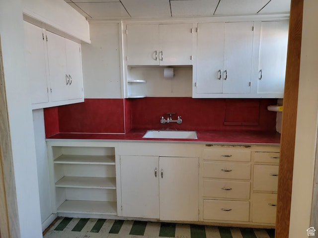 494 W 400 S, Cedar City, UT 84720 - kitchen featuring a sink, open shelves, light flooring, and white cabinetry