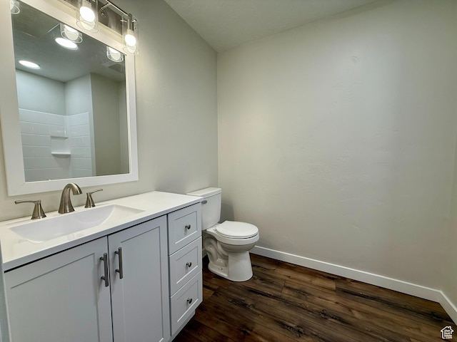 3870 S 2500 E, Vernal, UT 84078 - full bath with wood finished floors, toilet, baseboards, vanity, and a shower