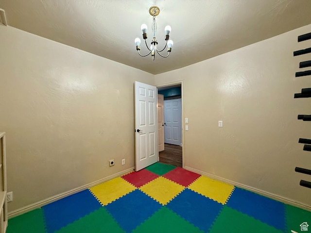 3870 S 2500 E, Vernal, UT 84078 - rec room with a chandelier, tile patterned floors, and baseboards