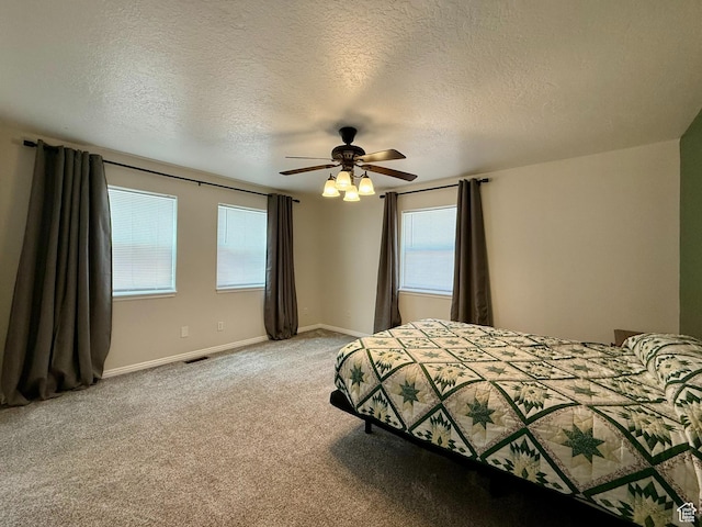 3870 S 2500 E, Vernal, UT 84078 - bedroom featuring a textured ceiling, baseboards, light carpet, and ceiling fan