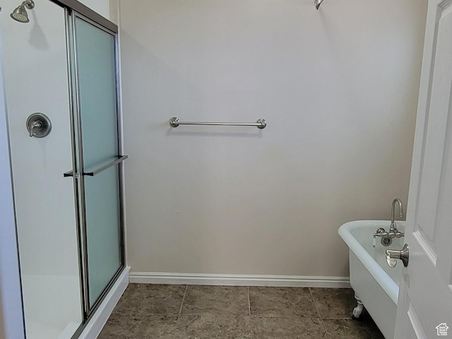 3870 S 2500 E, Vernal, UT 84078 - bathroom featuring a shower stall, baseboards, and a soaking tub