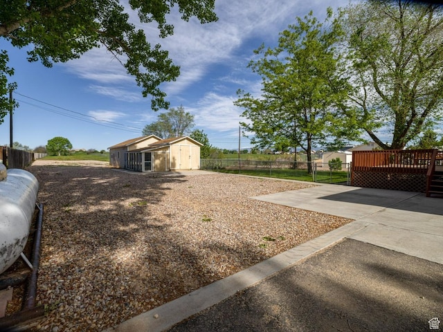 3870 S 2500 E, Vernal, UT 84078 - fenced yard with a deck, a patio, and an outdoor structure