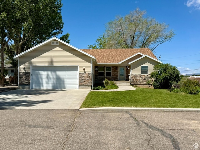 3870 S 2500 E, Vernal, UT 84078 - ranch-style house with stone siding, driveway, an attached garage, and a front lawn