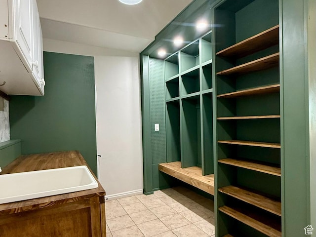 3870 S 2500 E, Vernal, UT 84078 - mudroom featuring light tile patterned floors, a sink, and baseboards