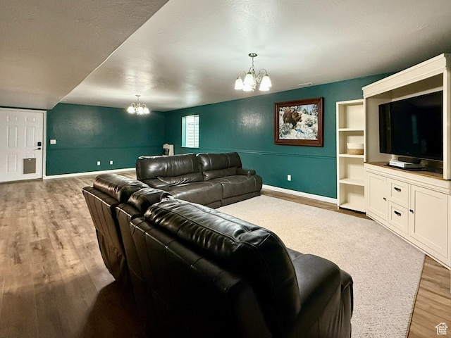 3870 S 2500 E, Vernal, UT 84078 - home theater room featuring a chandelier, light wood-type flooring, and baseboards
