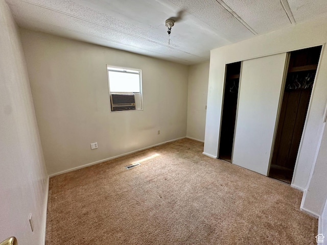 295 N 400 E, Nephi, UT 84648 - unfurnished bedroom with carpet flooring, a closet, a textured ceiling, and cooling unit