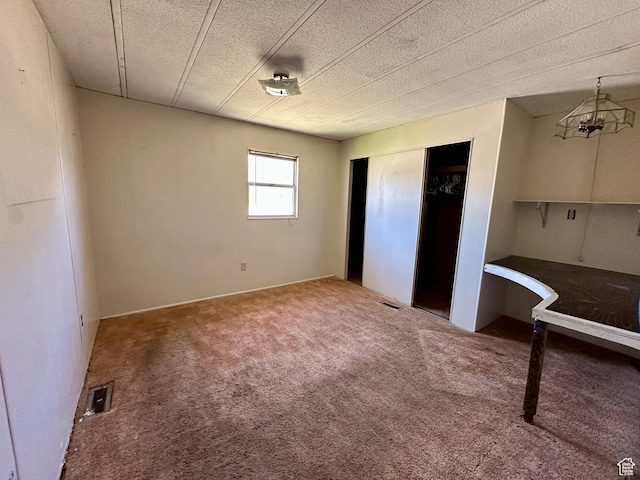 295 N 400 E, Nephi, UT 84648 - unfurnished bedroom featuring carpet floors, a closet, and a textured ceiling