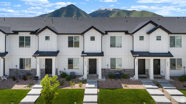 3457 E 1320 S, Spanish Fork, UT 84660 - view of front facade featuring board and batten siding, a mountain view, and stone siding