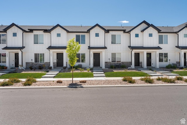 3457 E 1320 S, Spanish Fork, UT 84660 - view of front of home with board and batten siding, stone siding, and a shingled roof