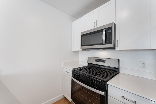 3457 E 1320 S, Spanish Fork, UT 84660 - kitchen featuring appliances with stainless steel finishes, light countertops, and white cabinets