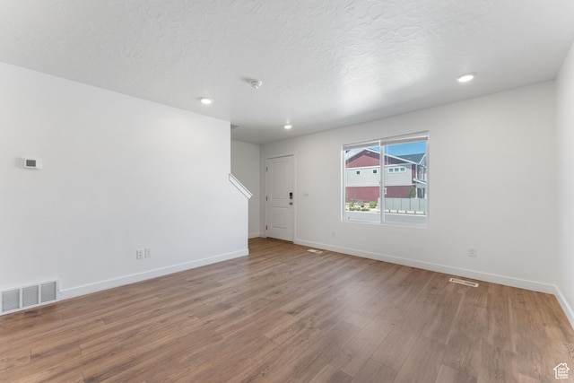 3457 E 1320 S, Spanish Fork, UT 84660 - empty room with wood finished floors, baseboards, recessed lighting, and a textured ceiling