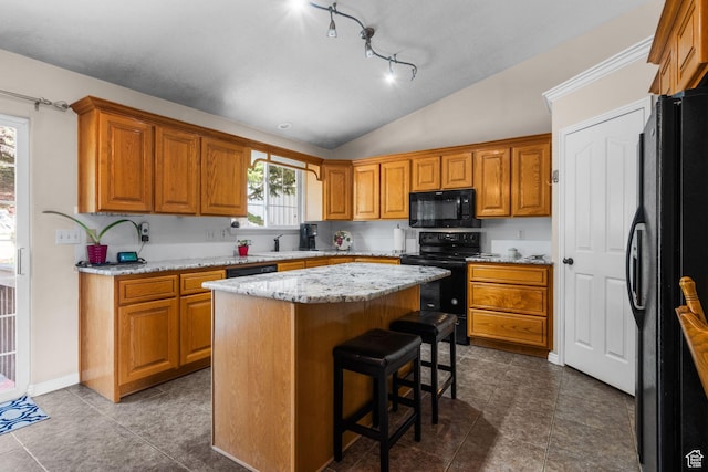 2239 E 3225 N, Layton, UT 84040 - kitchen with black appliances, vaulted ceiling, a center island, a sink, and brown cabinetry