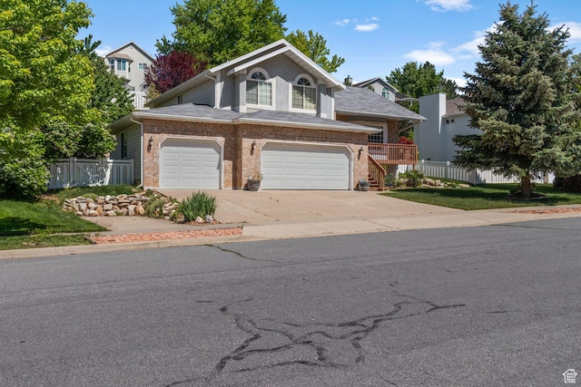 2239 E 3225 N, Layton, UT 84040 - view of front of property featuring brick siding, driveway, an attached garage, and stairs