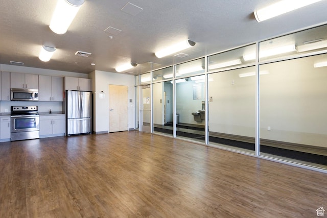 2271 W New Harvest Ln, Lehi, UT 84043 - empty room featuring dark wood-style flooring and a textured ceiling
