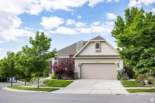 2271 W New Harvest Ln, Lehi, UT 84043 - view of front of home featuring stucco siding, concrete driveway, a garage, a chimney, and a shingled roof