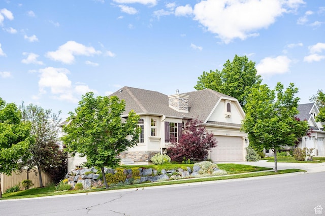 2271 W New Harvest Ln, Lehi, UT 84043 - french country home with concrete driveway, stucco siding, roof with shingles, a chimney, and stone siding